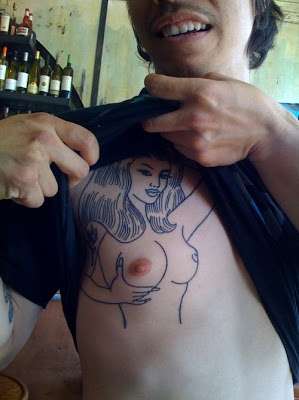 Funny tattoos: woman on the chest