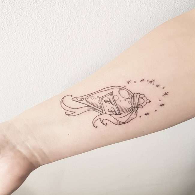 Tatuaje de Harry Potter - poción y estrellas