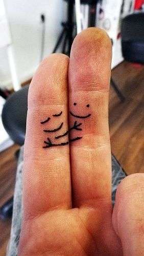 Funny tattoos: fingers hug